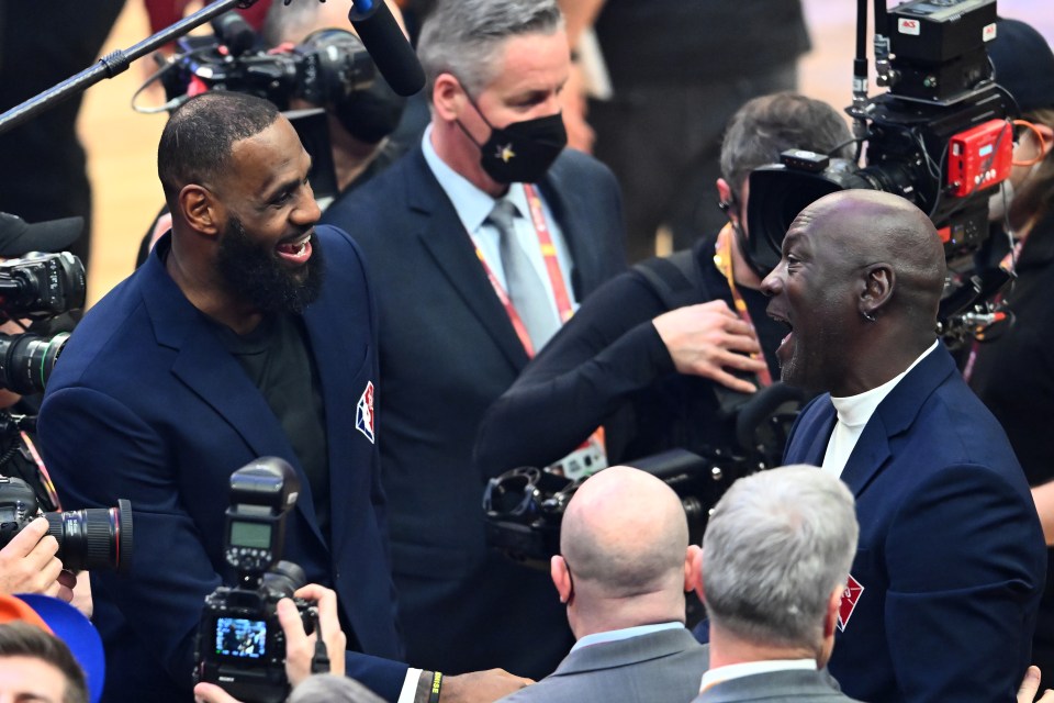 CLEVELAND, OHIO - FEBRUARY 20: Michael Jordan and LeBron James talk after the presentation of the NBA 75th Anniversary Team during the 2022 NBA All-Star Game at Rocket Mortgage Fieldhouse on February 20, 2022 in Cleveland, Ohio. NOTE TO USER: User expressly acknowledges and agrees that, by downloading and or using this photograph, User is consenting to the terms and conditions of the Getty Images License Agreement. (Photo by Jason Miller/Getty Images)