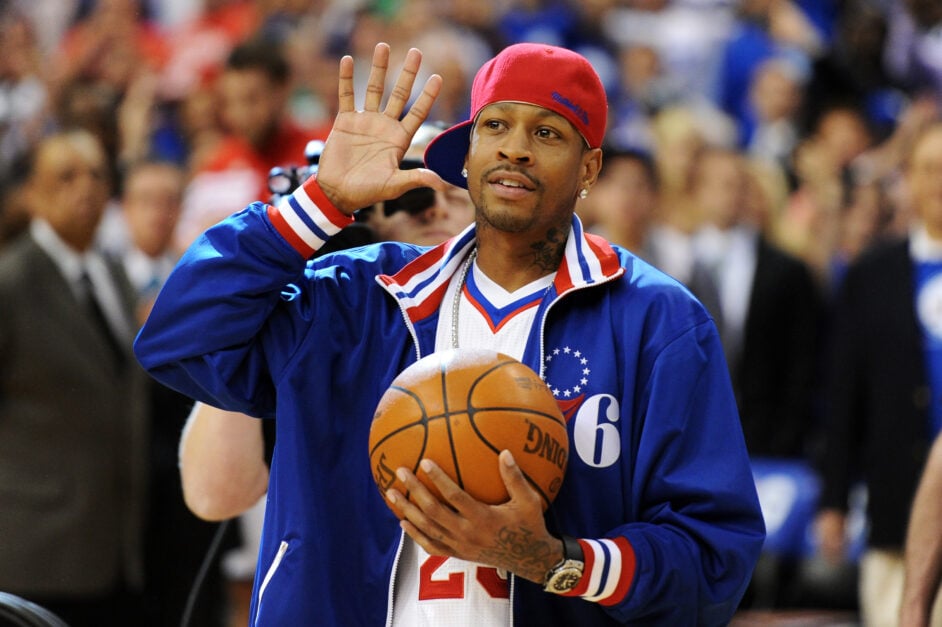 Philadelphia 76ers legend Allen Iverson waves at crowd while delivering the game ball vs the Boston Celtics in NBA Playoffs.