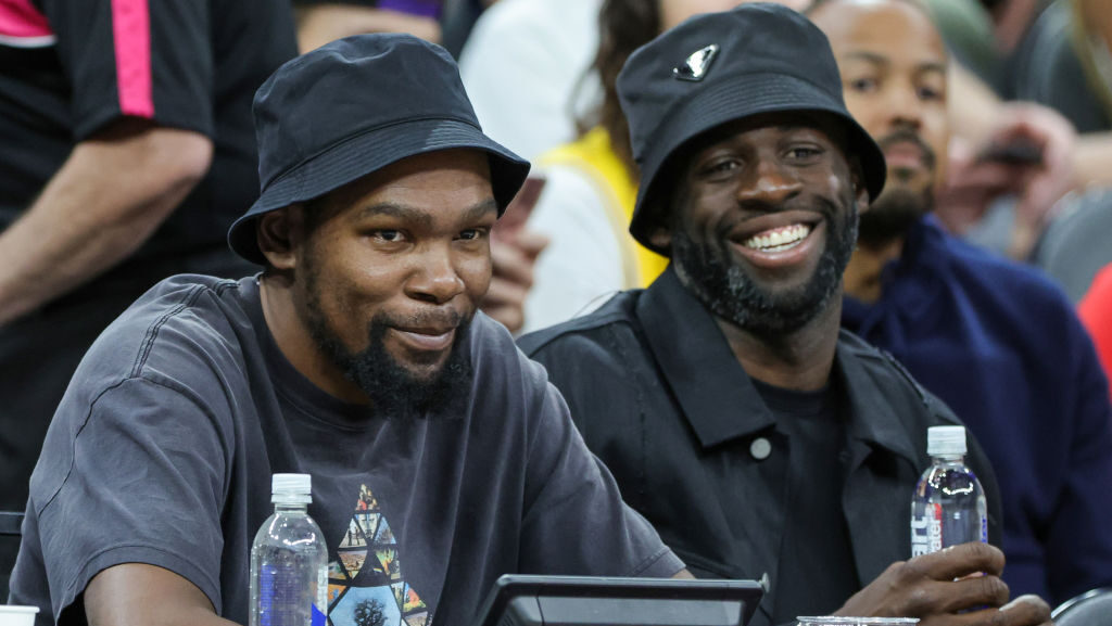 NBA players Kevin Durant (L) and Draymond Green attend a 2023 FIBA World Cup exhibition game betwee...