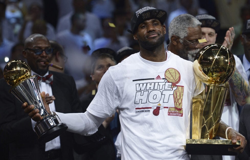 LeBron James shows off his NBA Finals MVP trophy and Larry O'Brien trophy after winning Game 7 vs the San Antonio Spurs in the 2013 NBA Finals.