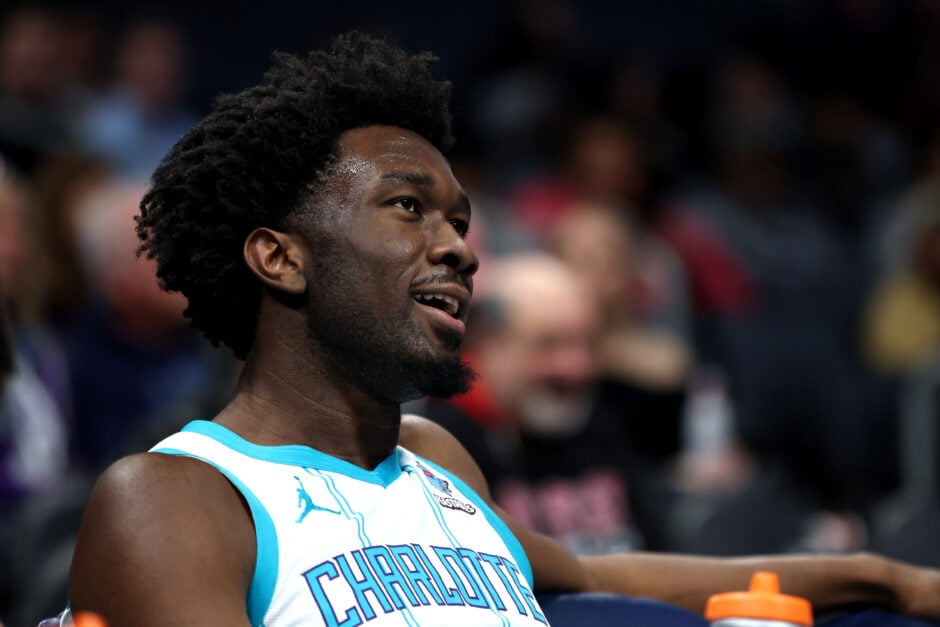 Charlotte Hornets' center Mark Williams sits on a chair during an NBA game.