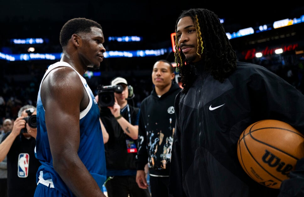Memphis Grizzlies guard Ja Morant confers with Minnesota Timberwolves guard Anthony Edwards