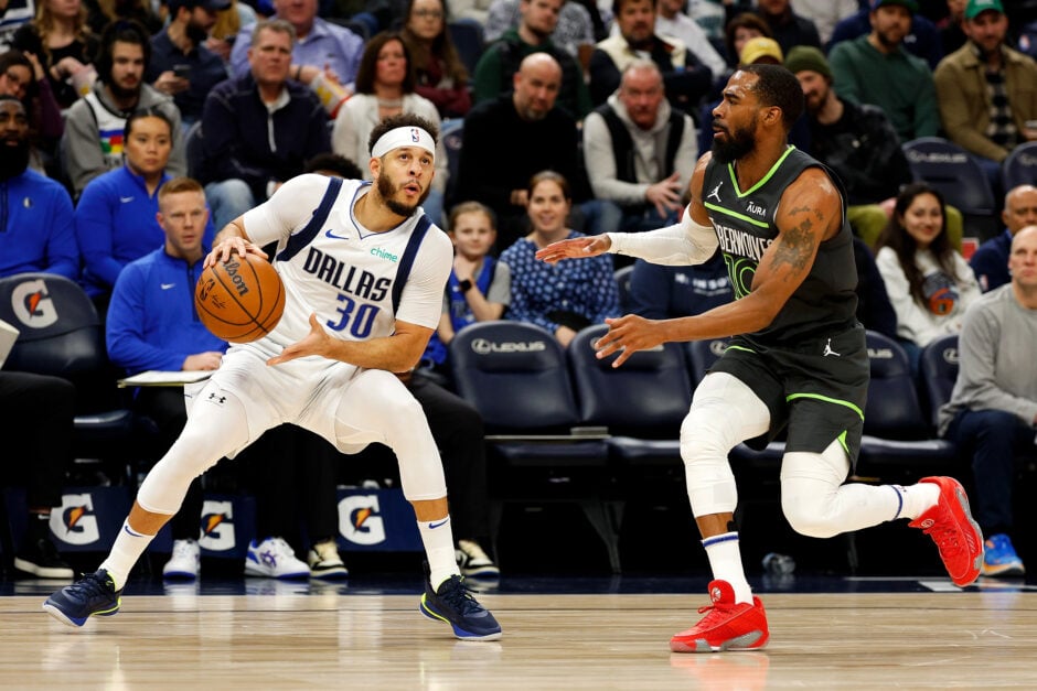 Dallas Mavericks guard Seth Curry handles the ball against Minnesota Timberwolves guard Mike Conley