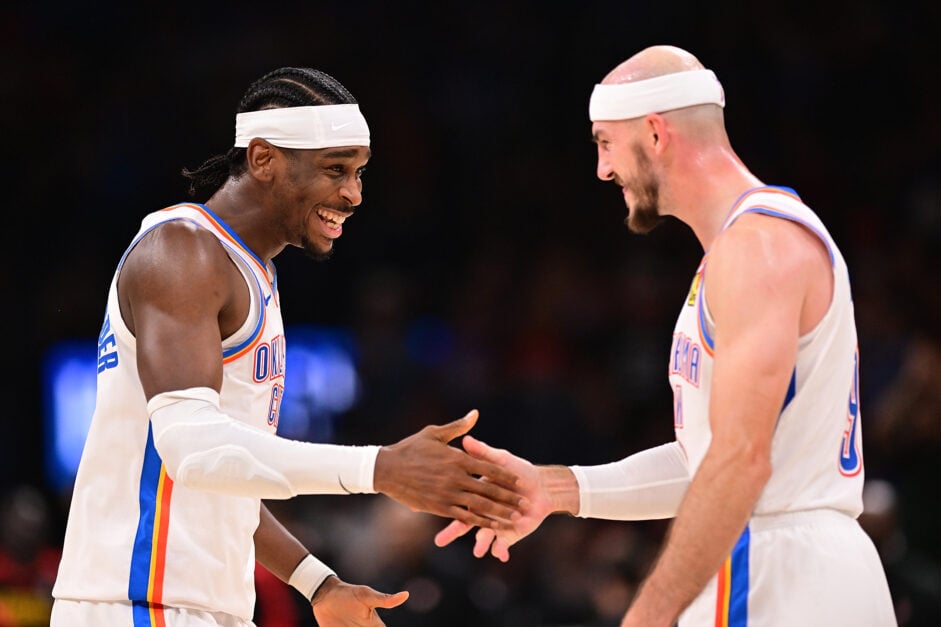 Shai Gilgeous-Alexander #2 and Alex Caruso #9 of the Oklahoma City Thunder celebrate during the second half against the Atlanta Hawks