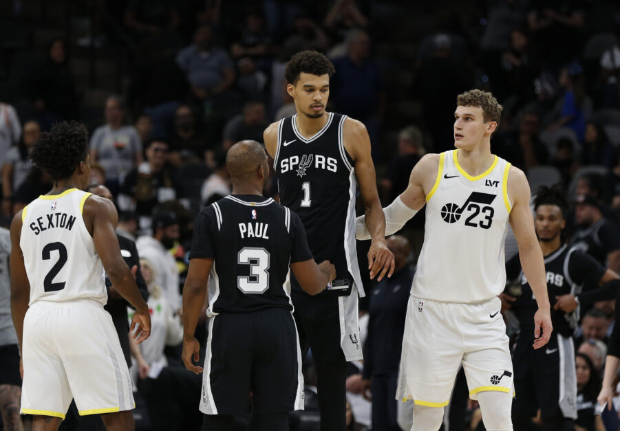 San Antonio Spurs center Victor Wembanyama stands next to Utah Jazz forward Lauri Markkanen