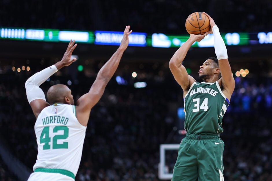 Giannis Antetokounmpo #34 of the Milwaukee Bucks is defended by Al Horford #42 of the Boston Celtics during the first half of a game