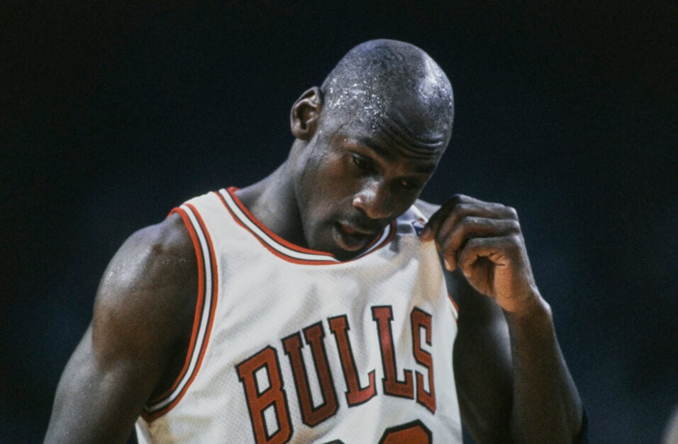 Chicago Bulls legend Michael Jordan looking down during an NBA game.