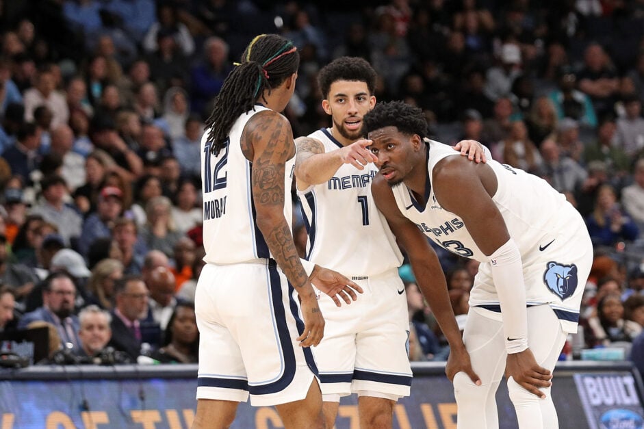 Memphis Grizzlies guards Scotty Pippen Jr. and Ja Morant confer with forward Jaren Jackson Jr.