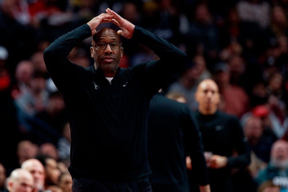 Mike Brown head coach of the the Sacramento Kings reacts on the court against the Portland Trail Blazers