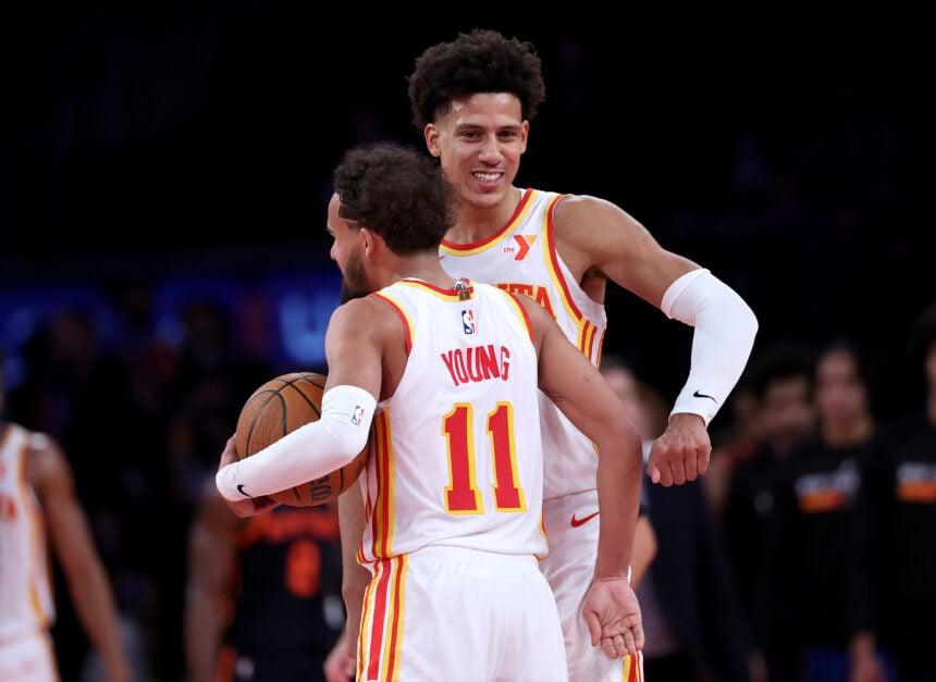 Atlanta Hawks forward Jalen Johnson hugs guard Trae Young