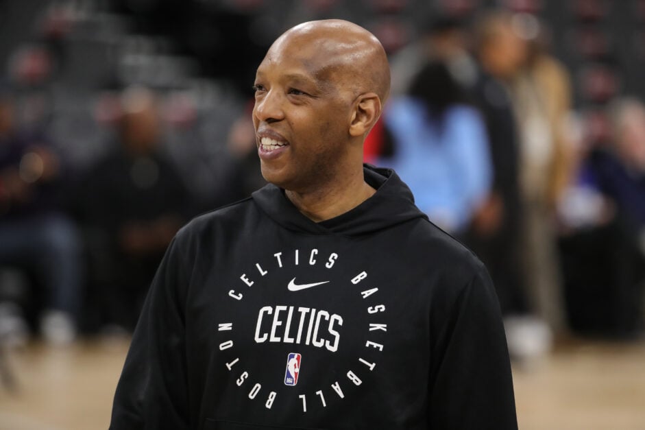 Boston Celtics assistant coach Sam Cassell smiles during warmups of a regular season game against the Los Angeles Clippers.