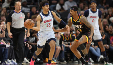 Jordan Poole #13 of the Washington Wizards handles the ball against Bradley Beal #3 of the Phoenix ...