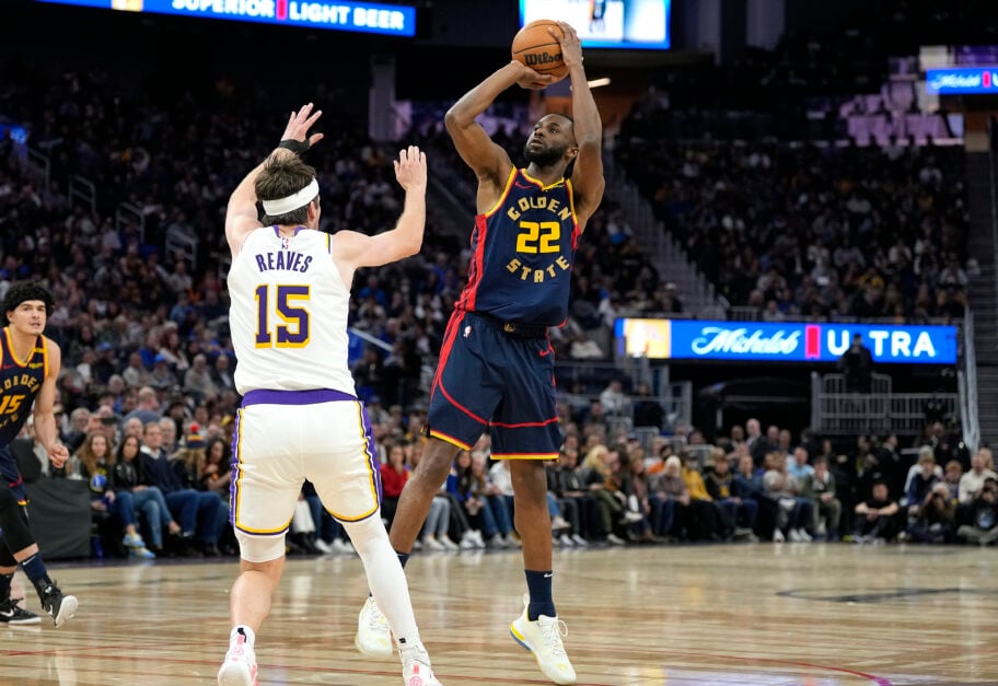 Andrew Wiggins #22 of the Golden State Warriors shoots over Austin Reaves #15 of the Los Angeles Lakers
