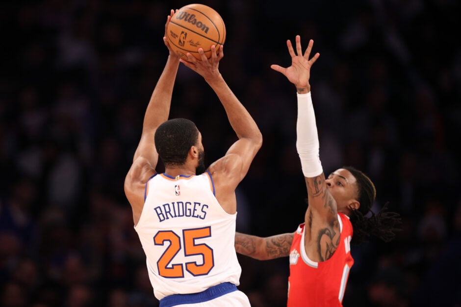 Mikal Bridges #25 of the New York Knicks shoots the ball as Ja Morant #12 of the Memphis Grizzlies contests during the first half at Madison Square Garden