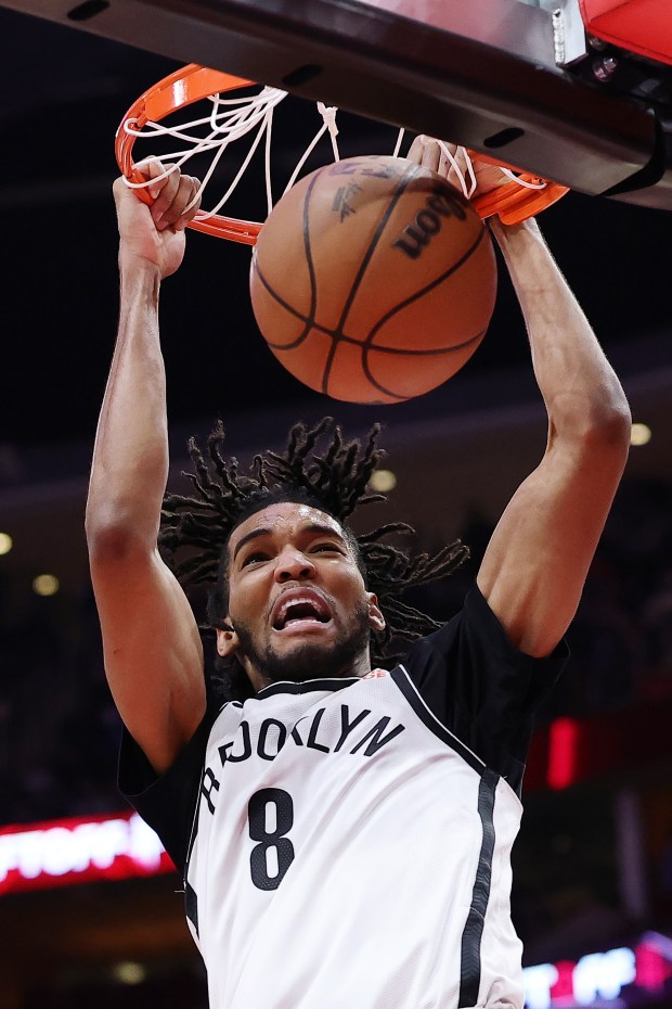 Ziaire Williams #8 of the Brooklyn Nets dunks against the Houston Rockets during the first half at Toyota Center on February 01, 2025 in Houston, Texas.