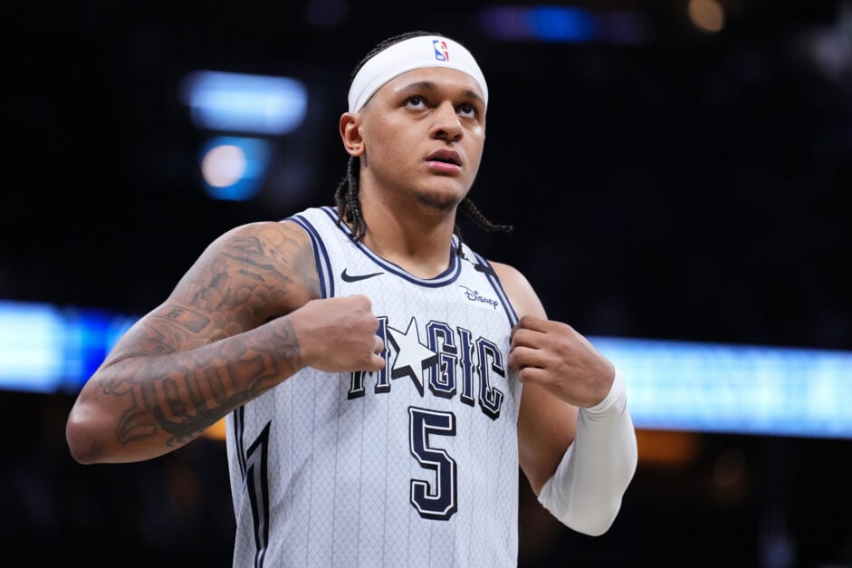 #5 of the Orlando Magic Paolo Banchero looks up while holding his jersey against the San Antonio Spurs.