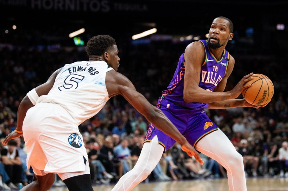 Kevin Durant #35 of the Phoenix Suns controls the ball against Anthony Edwards #5 of the Minnesota Timberwolves during the first half of the NBA game