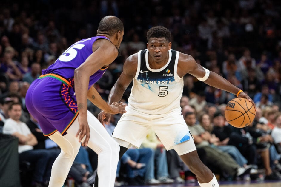 Minnesota Timberwolves' guard Antony Edwards dribbles against Phoenix Suns' forward Kevin Durant