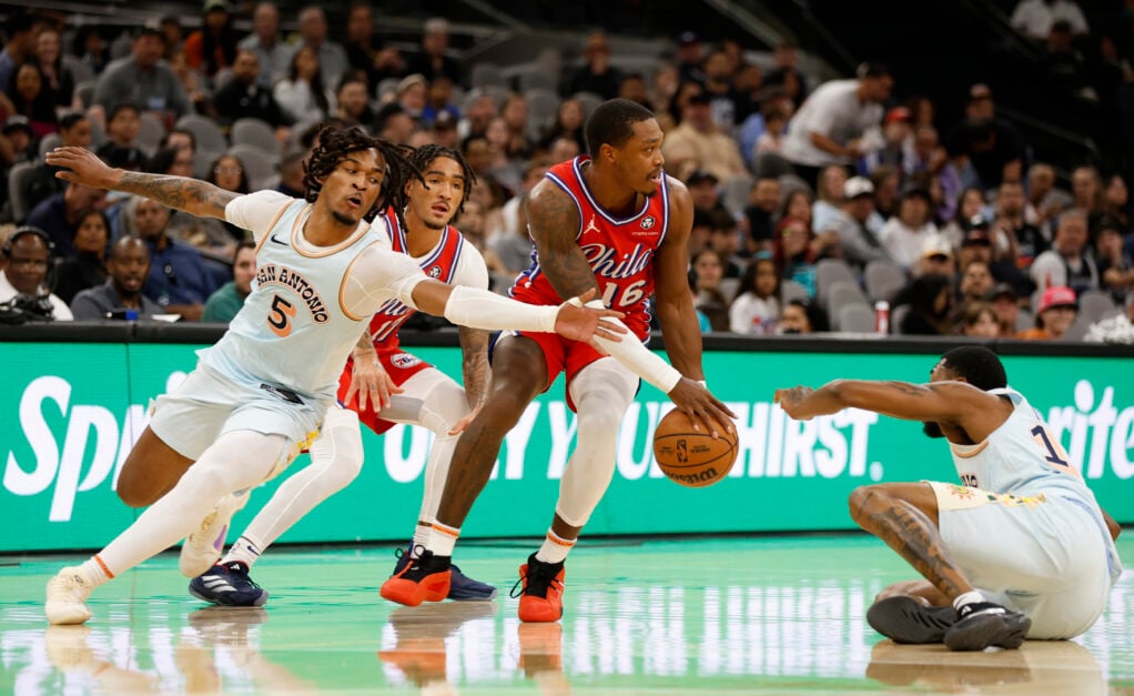 San Antonio Spurs guard Stephon Castle tries to steal the ball from Philadelphia 76ers guard Lonnie Walker IV