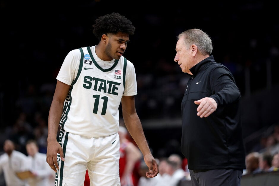 Michigan State guard Jase Richardson confers with head coach Tom Izzo