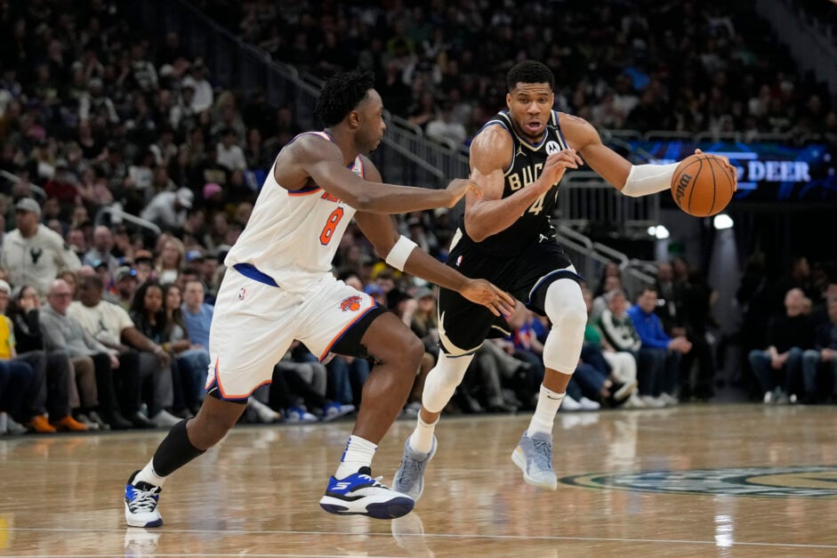 New York Knicks' forward OG Anunoby guards Milwaukee Bucks' forward Giannis Antetokounmpo