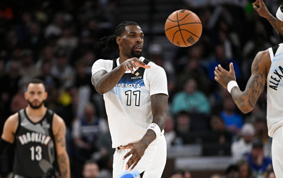 Minnesota Timberwolves center Naz Reid passes the ball.