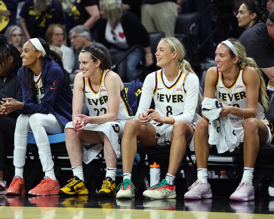 IOWA CITY, IA - MAY 4: Caitlin Clark #22, DeWanna Bonner #25, Sophie Cunningham #8 and Lexie Hull #10 of the Indiana Fever smile during the game against the Brazil Women's National Basketball Team during the WNBA preseason game on May 4, 2025 at Carver-Hawkeye Arena in Iowa City, Iowa. NOTE TO USER: User expressly acknowledges and agrees that, by downloading and or using this photograph, User is consenting to the terms and conditions of the Getty Images License Agreement. Mandatory Copyright Notice: Copyright 2025 NBAE (Photo by Jeff Haynes/NBAE via Getty Images)