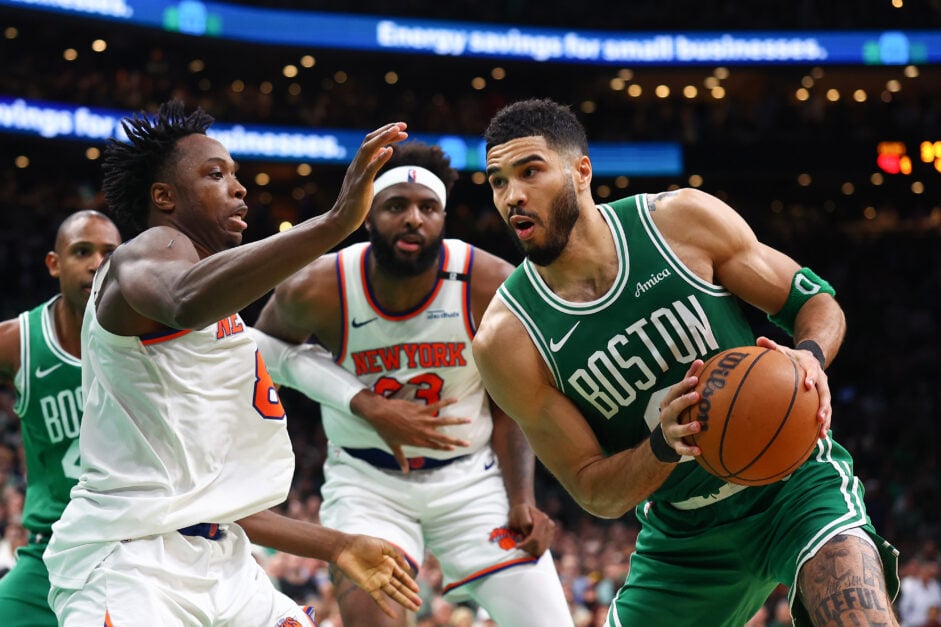 Jayson Tatum #0 of the Boston Celtics is defended by OG Anunoby #8 of the New York Knicks in the final seconds of the fourth quarter in Game Two of the Eastern Conference Second Round NBA Playoffs at TD Garden