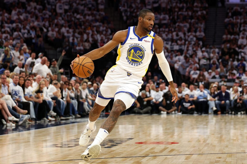 Jonathan Kuminga #00 of the Golden State Warriors dribbles the ball against the Minnesota Timberwolves in the first quarter of Game Two of the Western Conference Second Round NBA Playoffs.