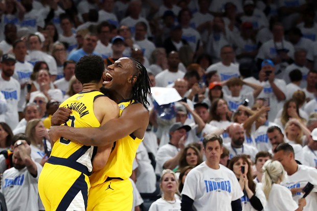 Indiana Pacers guard Tyrese Haliburton, left, celebrates with forward Aaron...