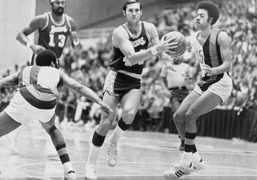 Los Angeles Lakers guard Jerry West dribbles against Baltimore