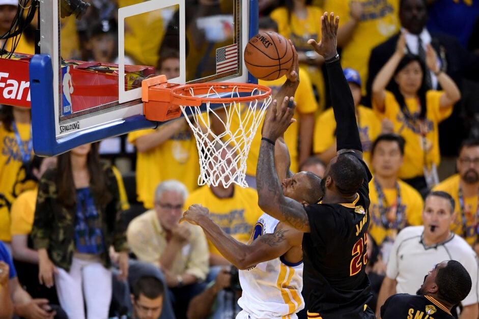 LeBron James #23 of the Cleveland Cavaliers blocks a shot by Andre Iguodala #9 of the Golden State Warriors in Game 7 of the 2016 NBA Finals at ORACLE Arena on June 19, 2016 in Oakland, California.