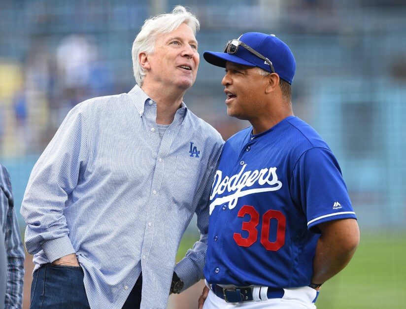 Mark Walter in smart dress relaxes with LA Dodgers head coach Dave Rodgers, smiling