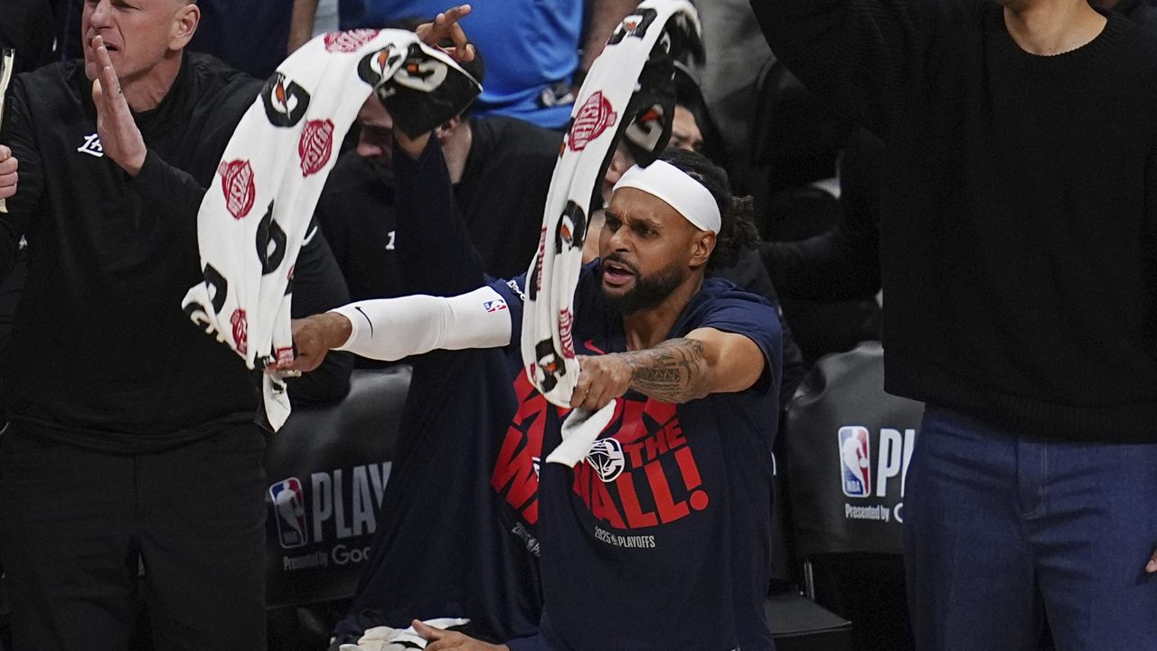 Los Angeles Clippers guard Patty Mills waved towels from the bench in Game 7 against the Denver Nuggets on May 3 in Denver.