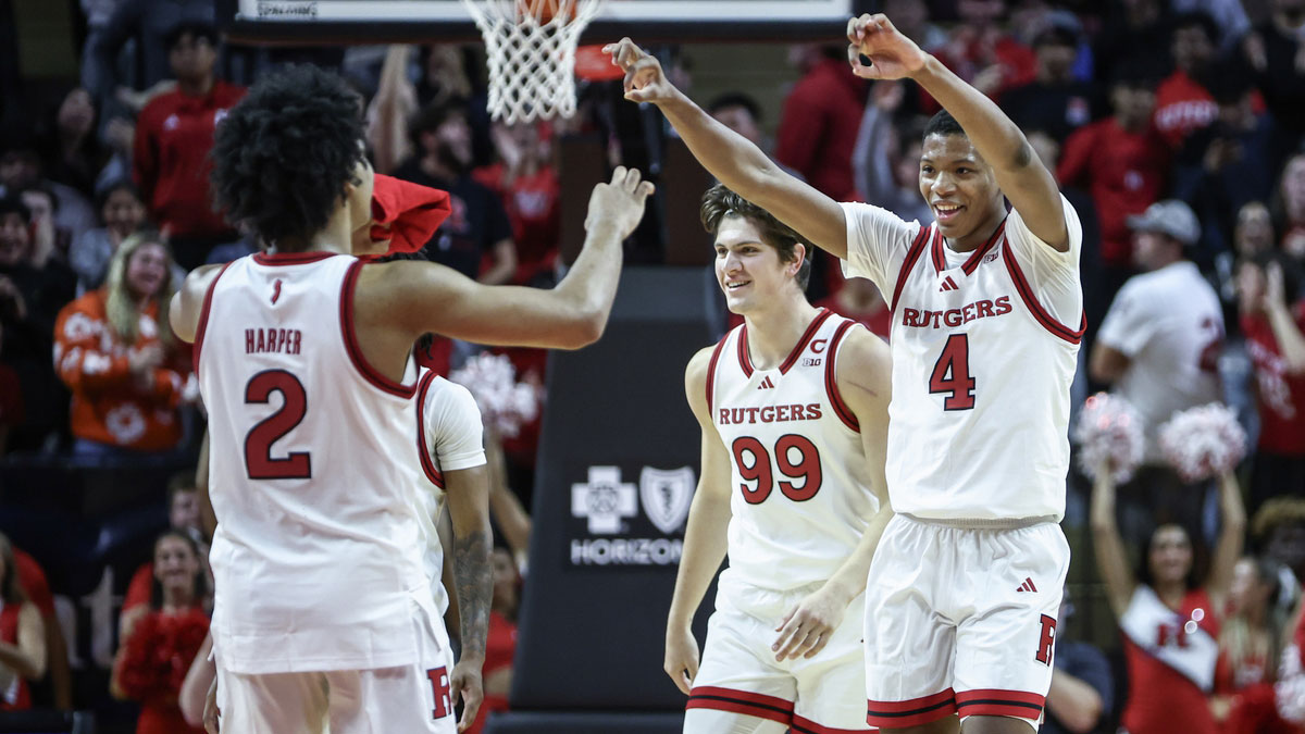 Rutgers Scarlet Knights guard Airious Bailey (4) celebrates with guard Dylan Harper (2) during a timeout in the second half against the St. John's Red Storm at Jersey Mike's Arena.