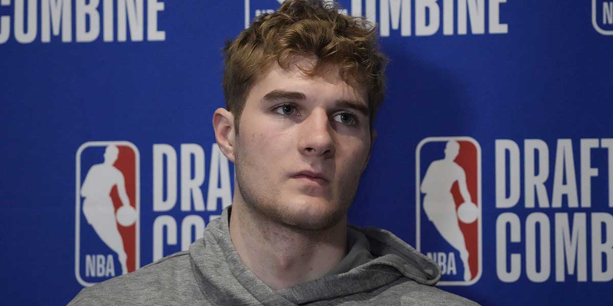 Liam McNeeley talks to the media during the 2025 NBA Draft Combine at Marriott Marquis Chicago.