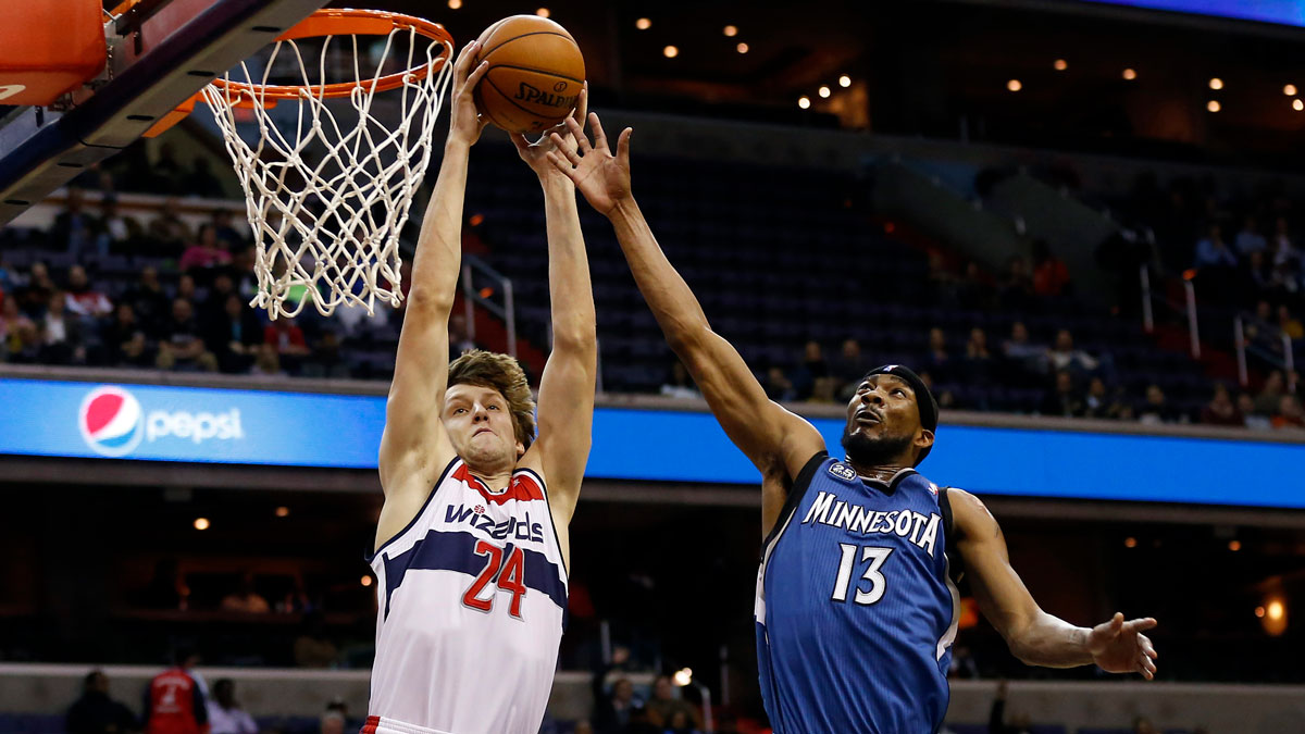 Washington Wizards power forward Jan Vesely (24) dunks the ball as Minnesota Timberwolves small forward Corey Brewer (13) defends in the second quarter at Verizon Center. 