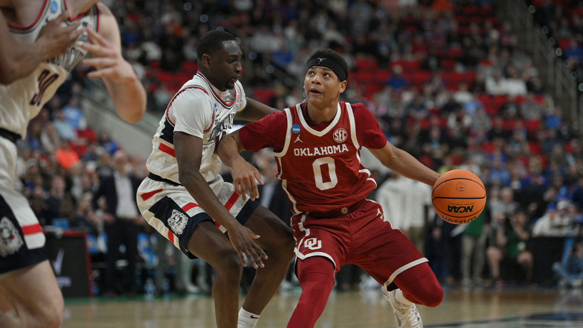 Oklahoma Sooners guard Jeremiah Fears (0) controls the ball against Connecticut Huskies during the second half at Lenovo Center.