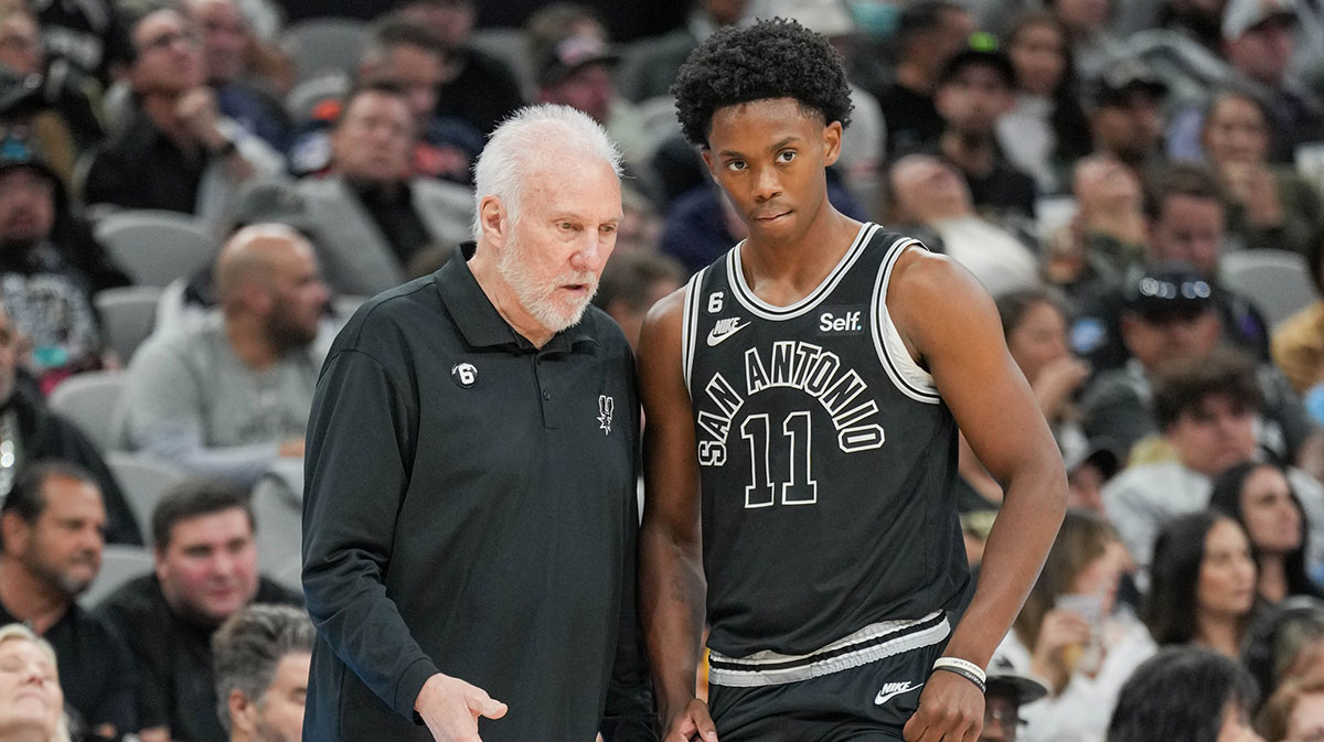 San Antonio Spurs head coach Gregg Popovich talks with San Antonio Spurs guard Joshua Primo (11) in the second half against the Charlotte Hornets at the AT&T Center.