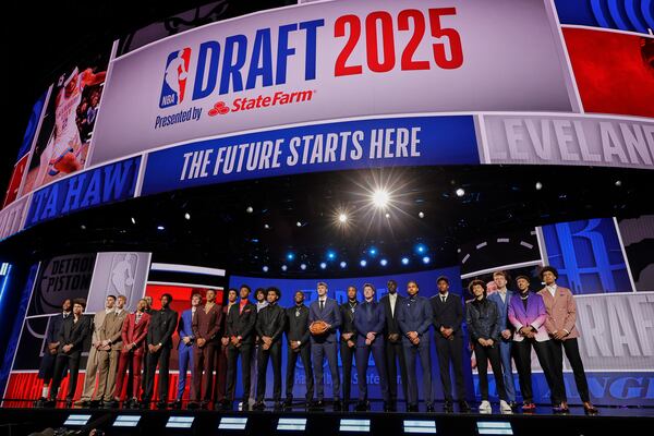 Prospective draft picks gather on stage for a photo before the first round of the NBA basketball draft, Wednesday, June 25, 2025, in New York. (AP Photo/Adam Hunger)