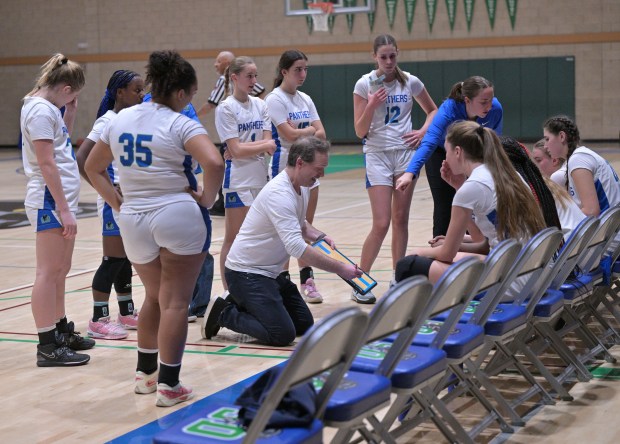 San Domenico girls basketball head coach Dave Levine talks to...