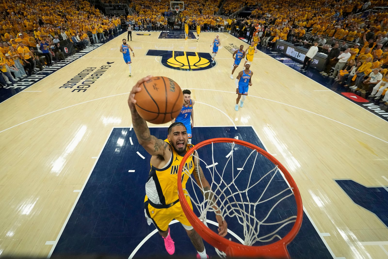 Indiana Pacers forward Obi Toppin (1) dunks against the Oklahoma City Thunder during the second half of Game 4 of the NBA Finals basketball series, Friday, June 13, 2025, in Indianapolis. (Kyle Terada/Pool Photo via AP)