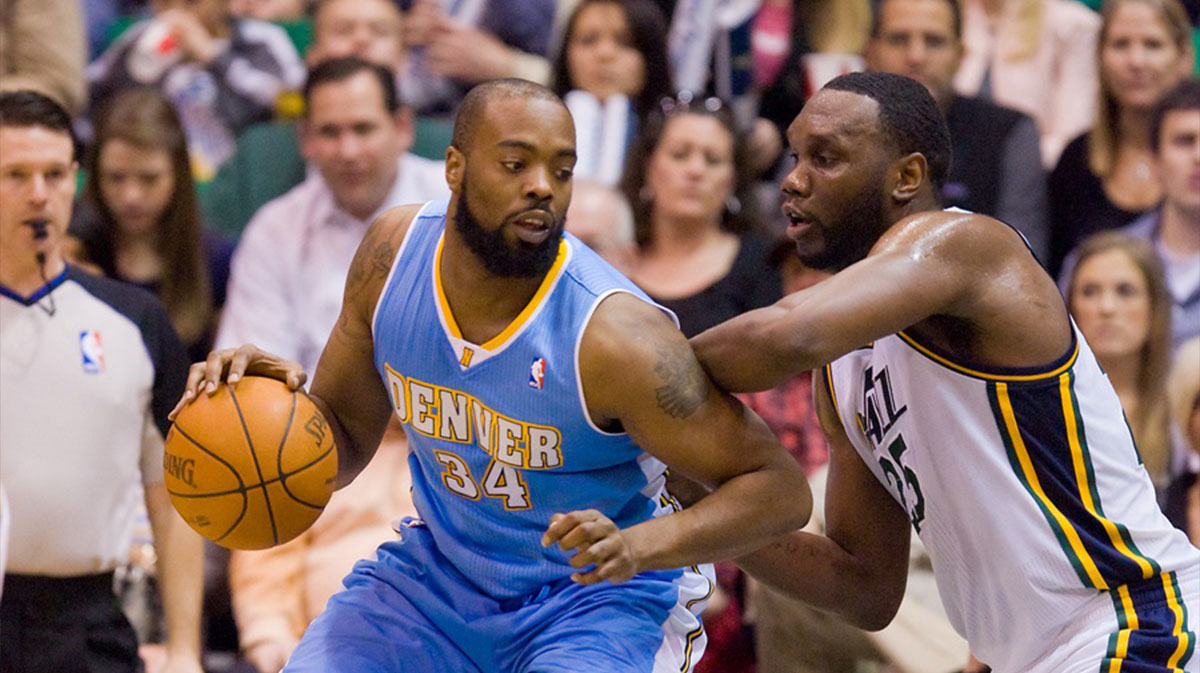 Denver Nuggets center Melvin Ely (34) is defended by Utah Jazz center Al Jefferson (25) during the second half at EnergySolutions Arena. The Jazz won 107-103.