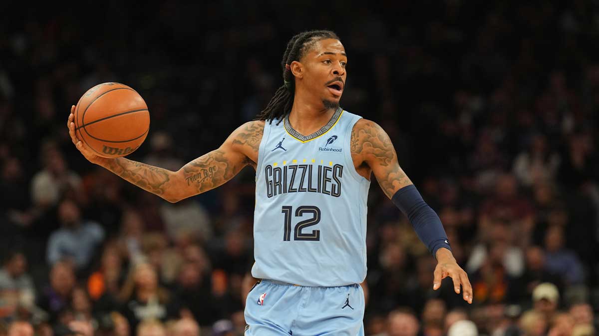 Memphis Grizzlies guard Ja Morant (12) controls the ball against the Phoenix Suns during the second half at Footprint Center.