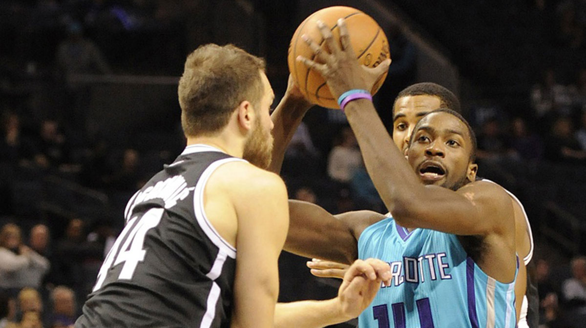 Charlotte Hornets forward Michael Kidd-Gilchrist (14) drives past Brooklyn Nets guard forward Bojan Bogdanovic (44) during the second half of the game at Time Warner Cable Arena. The Nets won 114-87.