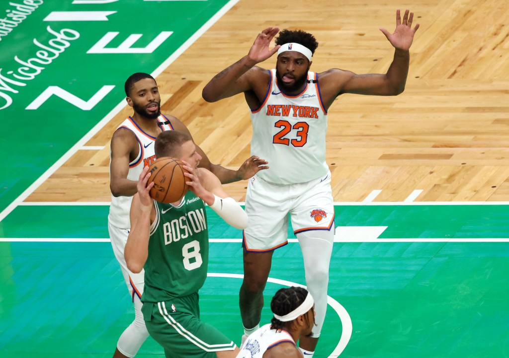 Mitchell Robinson (23) rushes to double team Kristaps Porzingis during the Knicks' 91-90 Game 2 comeback win over the Celtics on May 7, 2025.