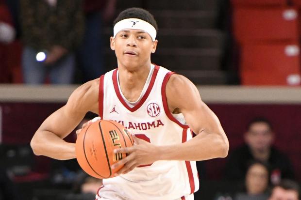 Oklahoma's Jeremiah Fears pushes down the court during the first half against Texas A&M, on Jan. 8, 2025, in Norman, Okla. (AP Photo/Kyle Phillips)
