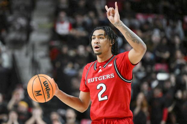 Rutgers guard Dylan Harper handles the ball during the first half against Maryland on Feb. 9, 2025, in College Park, Md. (AP Photo/Terrance Williams)