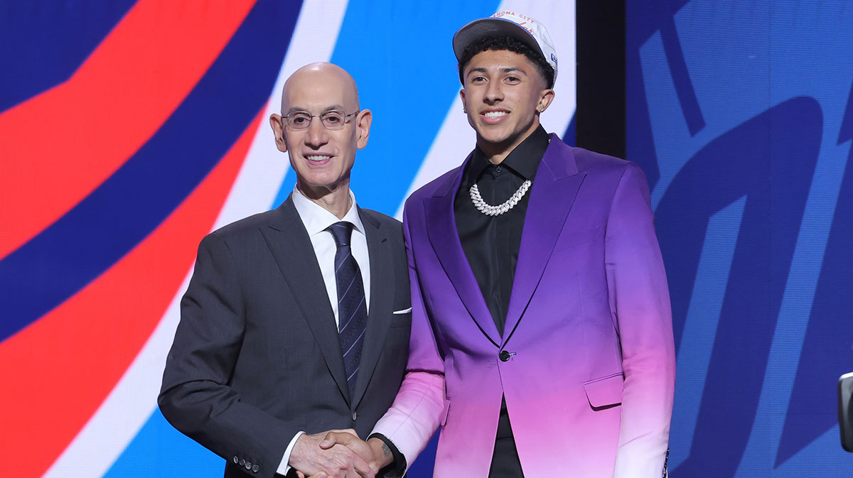 Nique Clifford stands with NBA commissioner Adam Silver after being selected as the 24th pick by the Oklahoma City Thunder in the first round of the 2025 NBA Draft at Barclays Center.