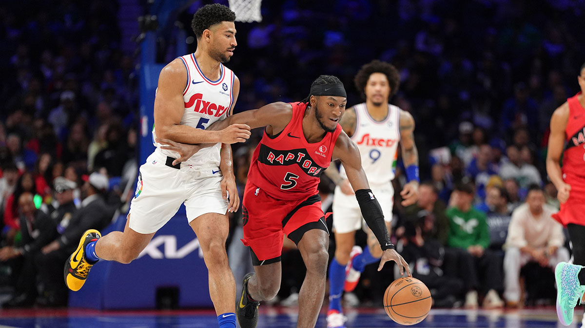Feb 11, 2025; Philadelphia, Pennsylvania, USA; Toronto Raptors guard Immanuel Quickley (5) drives against Philadelphia 76ers guard Quentin Grimes (5) in the third quarter at Wells Fargo Center. Mandatory Credit: Kyle Ross-Imagn Images